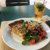 Smoked tofu and onion quiche with salad and an iced tea.   at Cafe Madrigal in Valencia