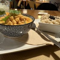 Thai red chickpea curry with pumpkin, spinach, coconut milk and brown basmati rice  at Cafe Madrigal in Valencia