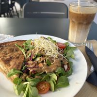 Smoked tofu and onion quiche with salad   at Cafe Madrigal in Valencia