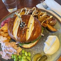 (Clockwise) fries, sauce, cornichons, edamame, slaw, kimchi, and pickled onions   at The Herbivore  in Lund