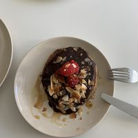 Oat/banana pancakes with choc, pb, berries and coconut   at Maria Limão in Lisbon