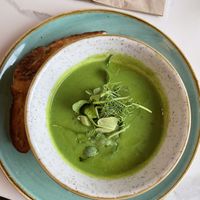 Pea and mint soup with toasted sourdough bread at Twelve Eatery in Bournemouth