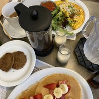 Just Egg omelet with beyond sausage, black beans, cilantro, avocado & onions. Vegan pancakes with fruit and a side of beyond sausage. French press coffee. It was all sooooo good!!  at Turning Point in Lawrence Township