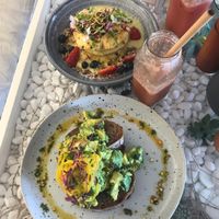 Vegan lemon curd pancakes with custard and vegan avo toast at The Milkman's Daughter in Mermaid Beach
