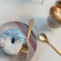 Doughnut and vegan white hot chocolate  at Naked Bakery in Edinburgh