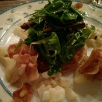 Endive and orange pie with parsnip on the side and leafy salad at Le Relais de Chambésy in Geneva