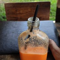 Alchemy menu map with a very small smoothie. at Alchemy in Koh Chang