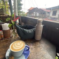 Cappuccino with a view (they told me the cookie was vegan as well. Not super sure about that though)  at Kafe in Ubud