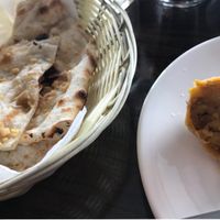 Garlic naan and vegetable samosa (vegan) at Radha's in Te Anau