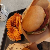 Swing burger with side of sweet potatoes at Swing Kitchen - Rosenthalerstraße in Berlin