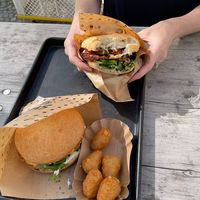 Chili burger (in hand), pink burger, and chili cheese bites at Swing Kitchen - Rosenthalerstraße in Berlin