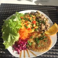 Lunch with beans, vegan burger, mashed squash, and salad at Cantinho da Regina in Sesimbra