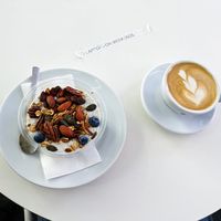 Vegan oatmeal and cappuccino with oatmilk at The Visit Coffee Roastery at The Visit Coffee Roastery in Berlin