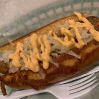 Field Roast Italian Dog! Sauerkraut & Sriracha mayo atop  at Dat Dog in New Orleans