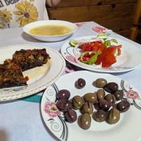 Salad, extra olives, soup and stuffed eggplant at Temi Albanian Food in Berat