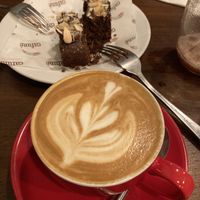 Flat white and chocolate almond cake at Cafuné in Preston