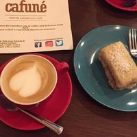 Decaf cappuccino (oat milk) and vegan coconut cake  at Cafuné in Preston