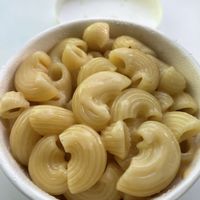 Mac and cheese with no bac’n or onion rings  at Oowee Vegan - Baldwin in Bristol