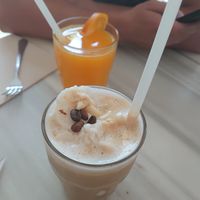 Iced caramel latte and orange juice  at Brunch and Cake By The Sea in Barcelona