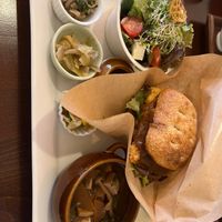 Tenshu no kimagure gozen - “chef’s special” today was a tempeh burger with 7 sides! Very filling! Miso soup is packed with veggies!! at Sachi no Ki in Hachioji