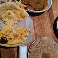 Vegan eggplant curry, garlic naan, and buckwheat roti at Dancing Yak in San Francisco