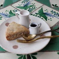 Warm banana scone with coconut milk and maple syrup 🙏 at Siesta Cafe  in Oita