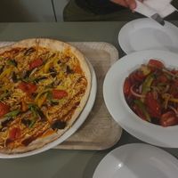 Pizza Verde with vegan cheese and salad siciliana at Laganon in Crete