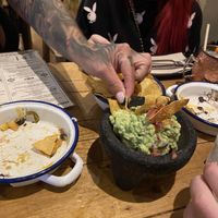 The guac and the empty nacho plates  at Gallo Santo in Barcelona