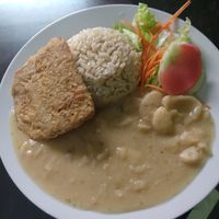 Whole grain rice, salad, mock meat, pallares at Delicias De La Naturaleza in Lima