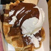 Waffle with chocolate sauce and vanilla ice cream   at VeganWaf in Brussels