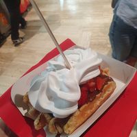 Waffle with chocolate sauce, strawberries and whipped cream at VeganWaf in Brussels