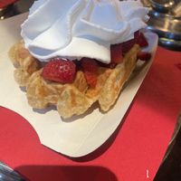 With strawberry and whipped cream   at VeganWaf in Brussels