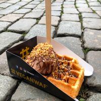 Waffle with hazelnut ice cream, chocolate sauce and nuts at VeganWaf in Brussels