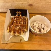 Amazing vegan waffle with maple syrup and crispy hazelnuts and a scoop of ferrero rocher icecream!! So worth it! at VeganWaf in Brussels