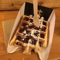 Waffle with chocolate sauce and sugar powder at VeganWaf in Brussels
