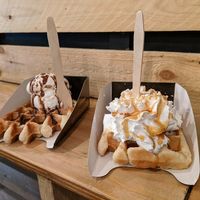 Waffle perfection. Chocolate sauce with salted peanut ice cream and caramel sauce with whipped cream. at VeganWaf in Brussels