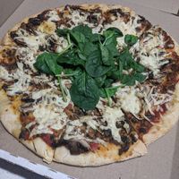 Mushroom pizza at Loving Hut in Northbridge