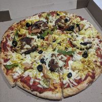 Supreme pizza at Loving Hut in Northbridge
