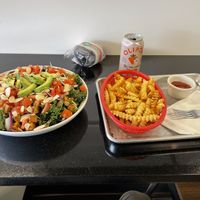 Spicy kale salad and house fries   at Can't Believe It's Vegan  in Westerville