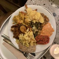 potato, schnitzel, vegetables, sausages at Tibits in Lausanne