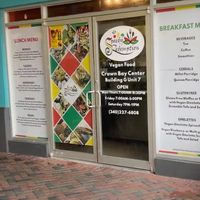 A photo of the outside of Speedy Redemption with their number. at Speedy Redemption in St Thomas