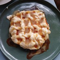 Waffle de pão de beijo com requeijão e caramelo at Casinha Cafe in Brasilia