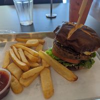 Caribbean jerk burger with fries at Vegan Plate in Roseville