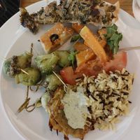 First plate 😎 Brussel sprouts in sauce, olive ciabatta, spinach pie, tomatoes with salt, butternut squash roasted, mixed rice and tatar sauce. at DaTerra - Rua da Rosa in Lisbon