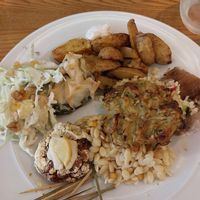 Fried potatoes, spinach and courgette fritata, lentil burgers, salad. at DaTerra - Rua da Rosa in Lisbon