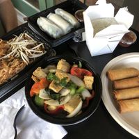 Spicy basil stir fry, pad Thai (no egg + added mock chicken), fried and fresh spring rolls.  at Taste of Thai Express in Ithaca