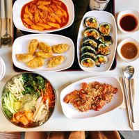 Our Spread!!! (Clockwise from red spicy rice cakes) - Tteokbokki, Kimbap, Kong Chicken, Bibim Naengmyeon, Mandu (dumplings). at Maru JaYeonSik Kimbap in Seoul