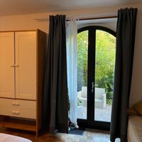 bedroom with outdoor seating access at La Beuratte in Cornimont