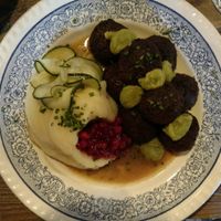 Amazing vegan balls with mash and loganberry and picked cucumber at Brasserie Uno in Zermatt