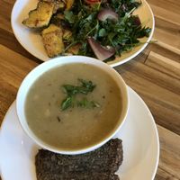Potato Leek Soup with gluten free crostini, three scoop salad plate in background.  at Baagan in Moraga